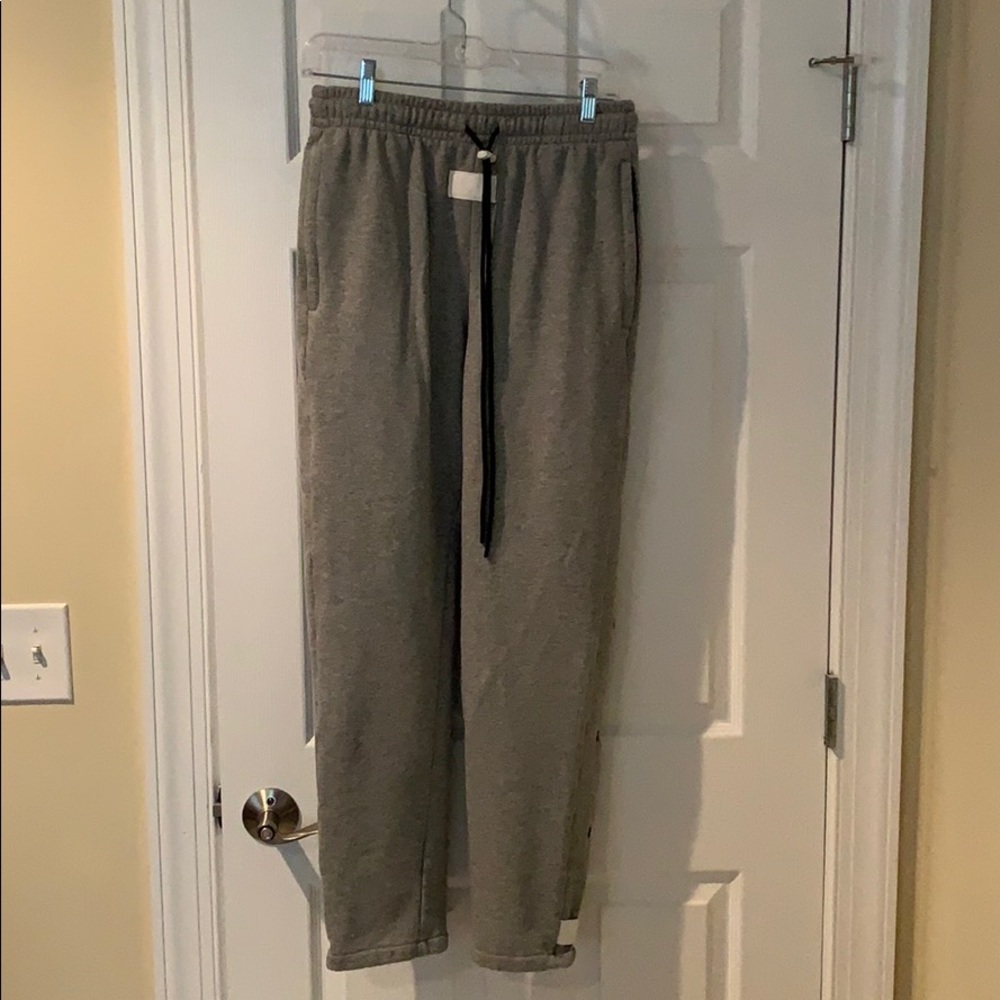 Destructive snap button warm up sweat pants